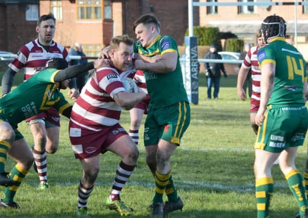Wayne Wilson attempts to break through the West Hull defence and set up a Thornhill Trojans attack during last Saturdays BARLA National Cup tie at Overthorpe Park. Picture: Dave Jewitt.