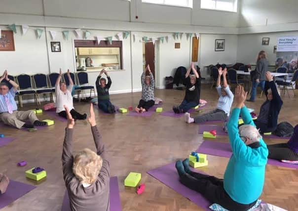 FREE CLASS: Older people enjoy a yoga session at Batley Old Peoples Centre.