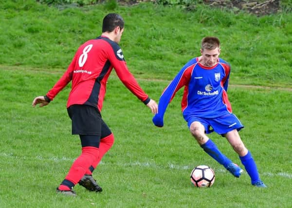 Battyeford's Joshua Auty looks to take on Snowdon's Javed Patel during the Heavy Woollen Sunday League Division One clash.