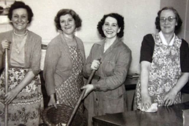 NIGHT SHIFT: Four happy working women with their buckets and mops getting ready to give the offices at Wormalds and Walkers in Thornhill Lees, a good cleaning. Women like these worked evenings to supplement the family income so their children could have a better life.