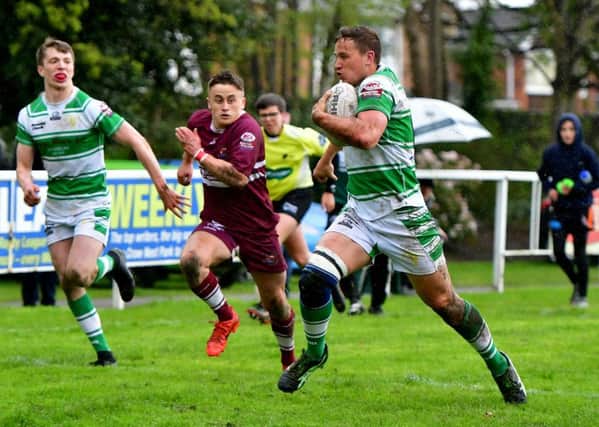 DAnny Crabtree races away to score Dewsbury Celtic's match winning try against Millom.