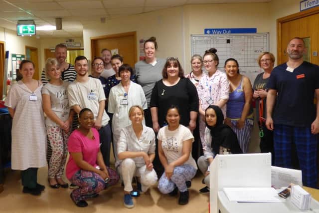 MAJOR CAMPAIGN: Members of the team on Ward 11 at Dewsbury Hospital in their pyjamas.