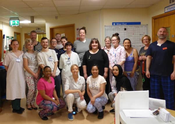 MAJOR CAMPAIGN: Members of the team on Ward 11 at Dewsbury Hospital in their pyjamas.