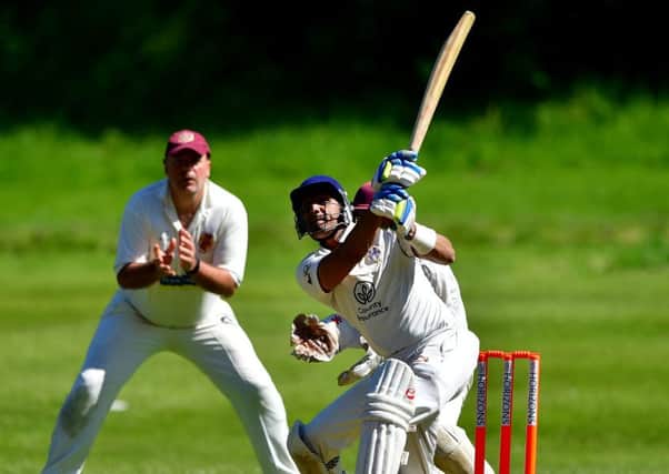 Imran Mayat hits out for Crossbank Methodists in their Heavy Woollen Cup tie against Methley last Sunday.