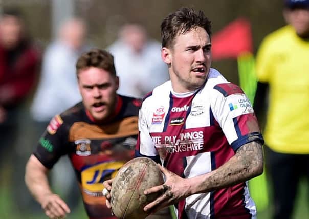 Danny Ratcliffe scored two tries and was influential in other Thornhill attacks as the Trojans earned victory over Dudley Hill which keeps them top of National Conference League Division One.